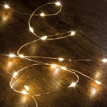 Soft glow rice lights on copper strand for Nativity display accessory