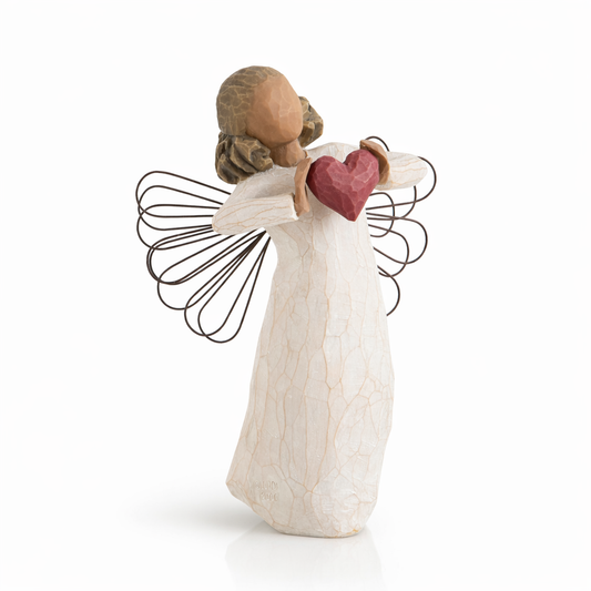 With Love Angel figurine holding a red heart as a heartfelt love gift