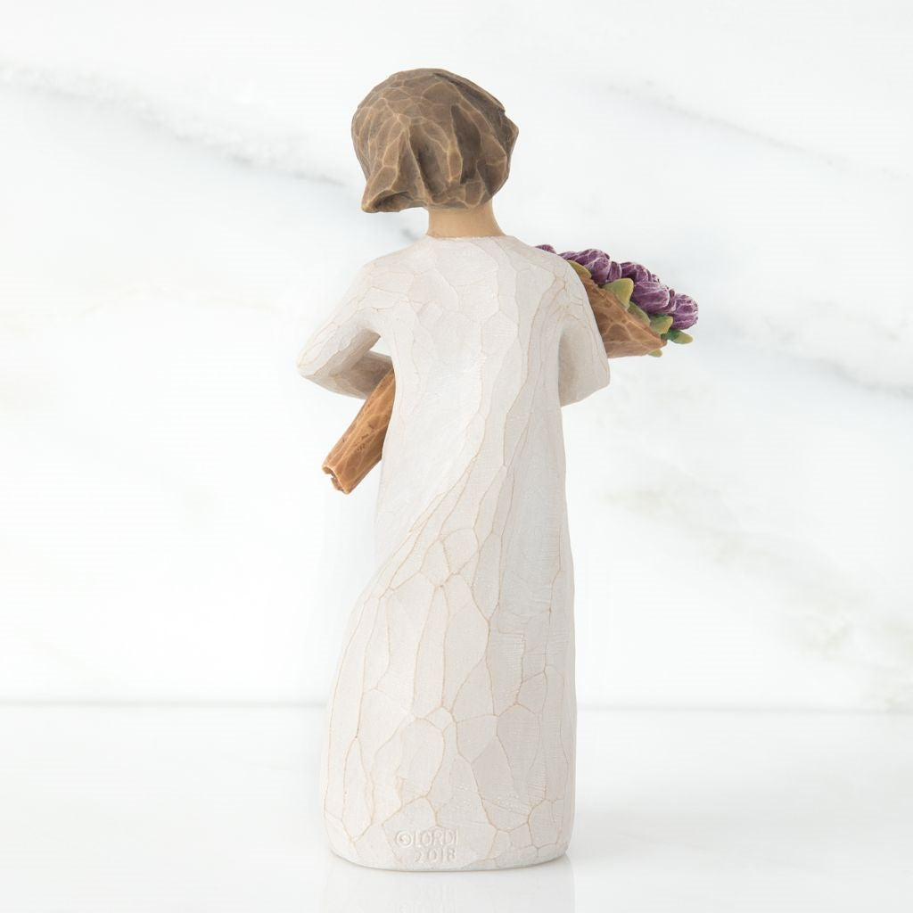 Surprise Figurine holding flowers as a wonderful wishes keepsake gift