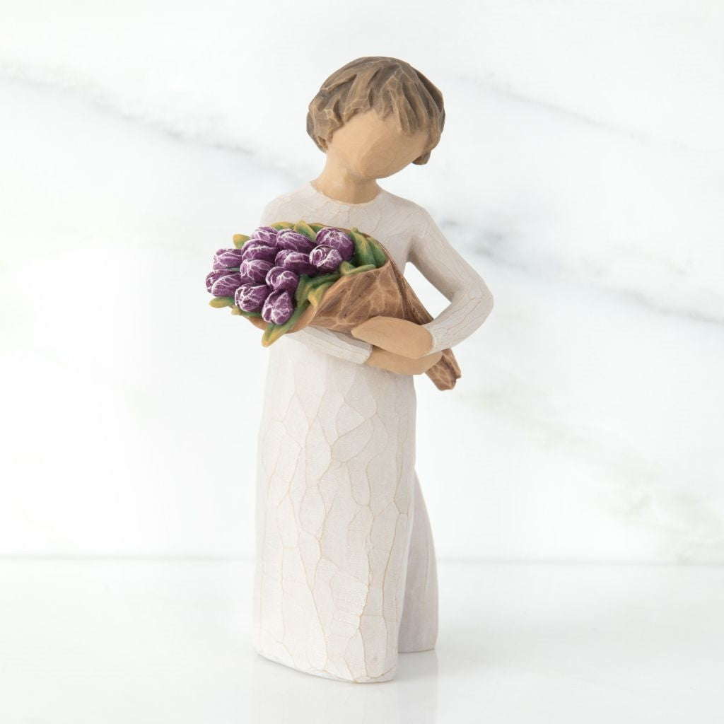 Surprise Figurine holding flowers as a wonderful wishes keepsake gift